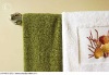 GREEN AND EMBROIDERED TOWEL