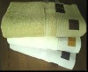 Solid bath towel with jacquard on the border