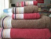 Solid towel with dobby border