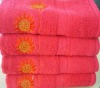 solid bath towel with embroidery and border