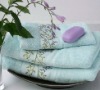 100% solid terry towel with embroiderey border