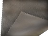 Coated shrink-resistant polyester fabric for bags