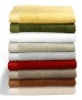 Cotton terry towels in plain dyed