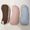 Cylindrical pillow with different colours and different material