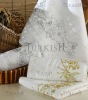 Gold and silver embroidered terry towels with beads and strass
