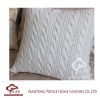 Knitted white cushion