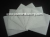 Low lint woodpulp nonwoven laminated spunlace