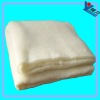 Nonwoven polyester wool filler for bedding