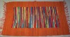 Orange bordered cotton rug with stripes