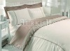 Plain dyed bed linen with laces and embroidery