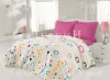 Printed cretone bedlinen with plain pillows