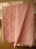 Quilted pink wool comforter