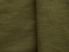 Reactive dyed blackish green knitted denim fabric