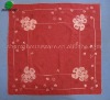 Red fabric table cloth with white embroidery