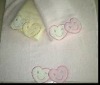 Solid bath towel with applique