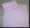 Solid bath towel with bright border