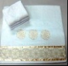 Solid bath towel with embroidery and golden lace