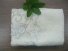 Solid bath towel with embroidery and lace