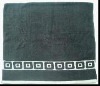 Solid border bath towel