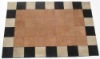 Woven leather rug with checkered border