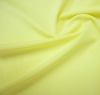 Yellow smooth nylon lycra knitted fabric textile