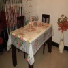 a fashionable  great-value waterproof and oilproof red-flower PVC plastic tablecloth
