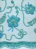 cord and spangle embroidery fabric on stone mesh