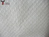 embossed oil absorbent material for wipe