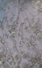 fancy dress fabric with metallic machine embroidery with stones