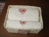 gift towel set in a paper basket