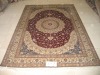 handknotted persian silk carpet
