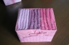 small cotton face towel in paper basket