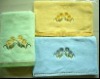 solid bath towel with embroidery and border