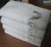 solid bath towel with embroidery and border