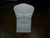 white spandex chair cover with buckle on the back