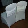 white spandex chair cover with cross in the back