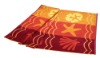 yellow and red printed beach towel